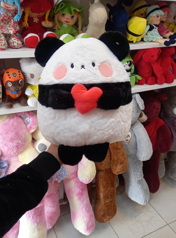 Panda heart doll in hand